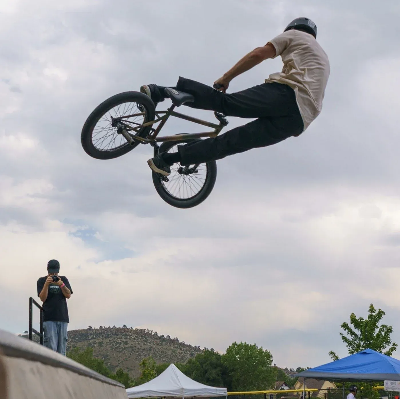 BMX rider boosting out of the plaza