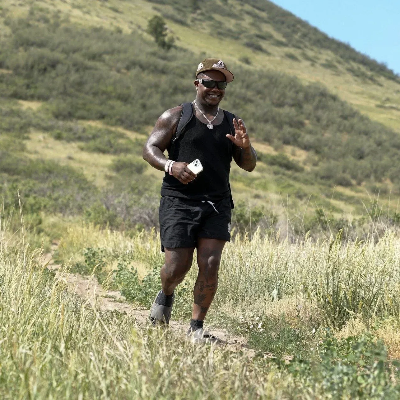 Trail runner cruising down the hillside above Lyons