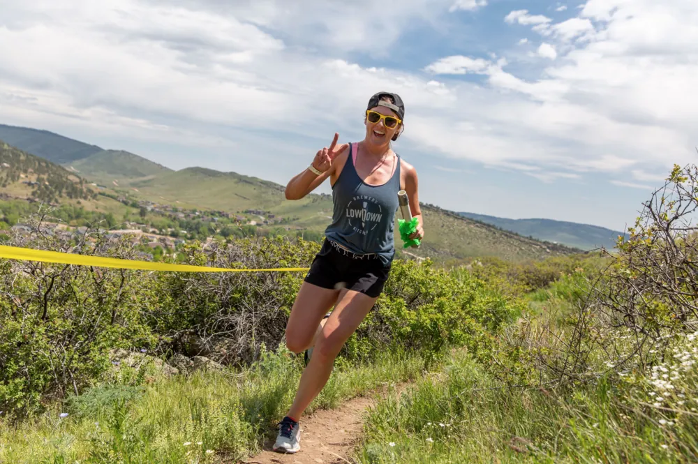 Runner on singletrack above Lyons