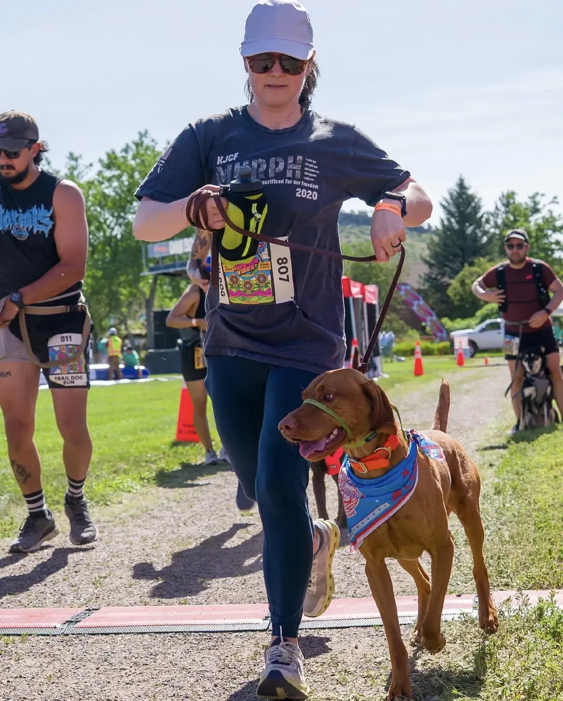 Owner and dog crossing the finish