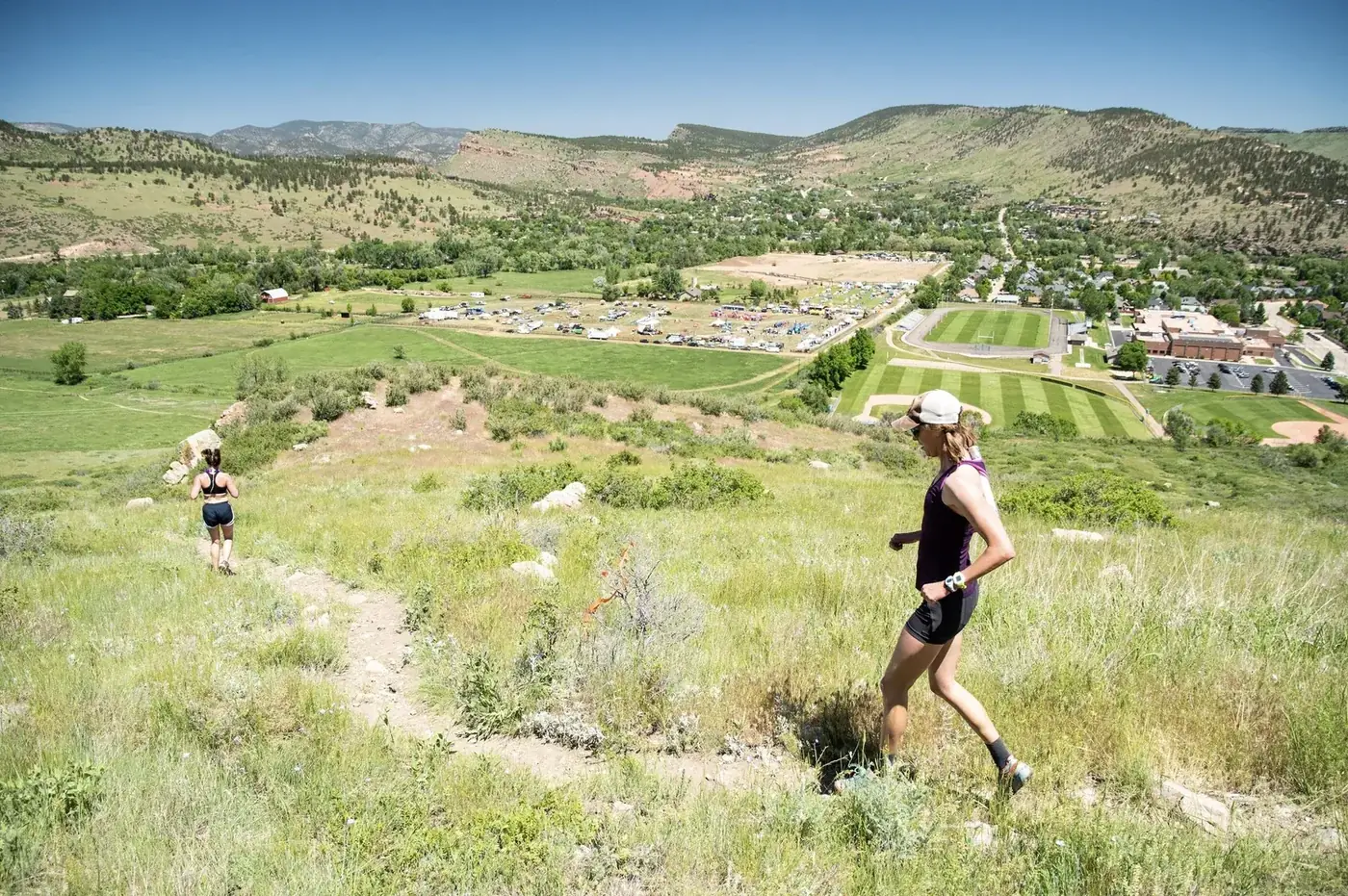 Trail runner on the hillside above the festival
